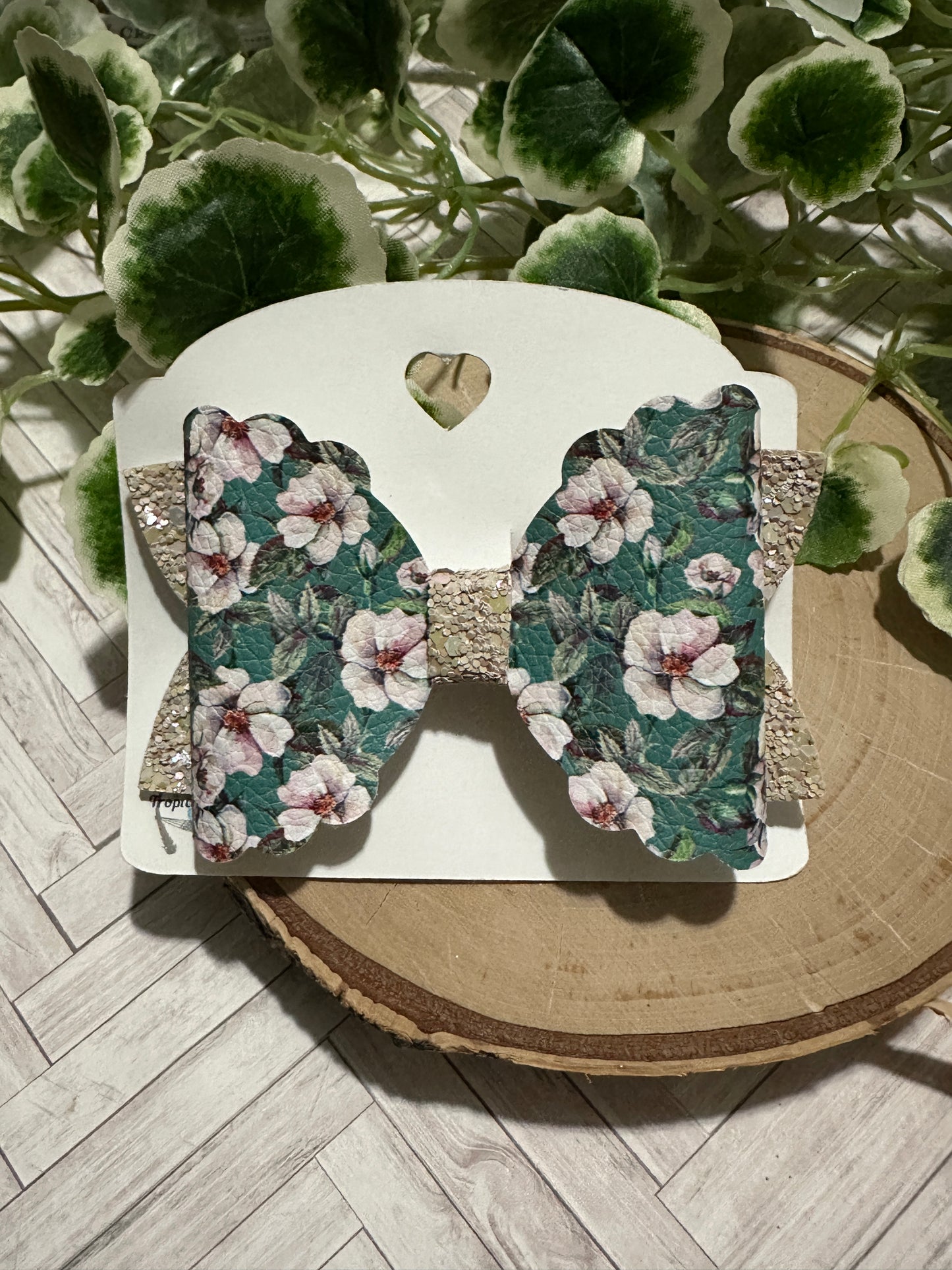 White flower on green hair bow