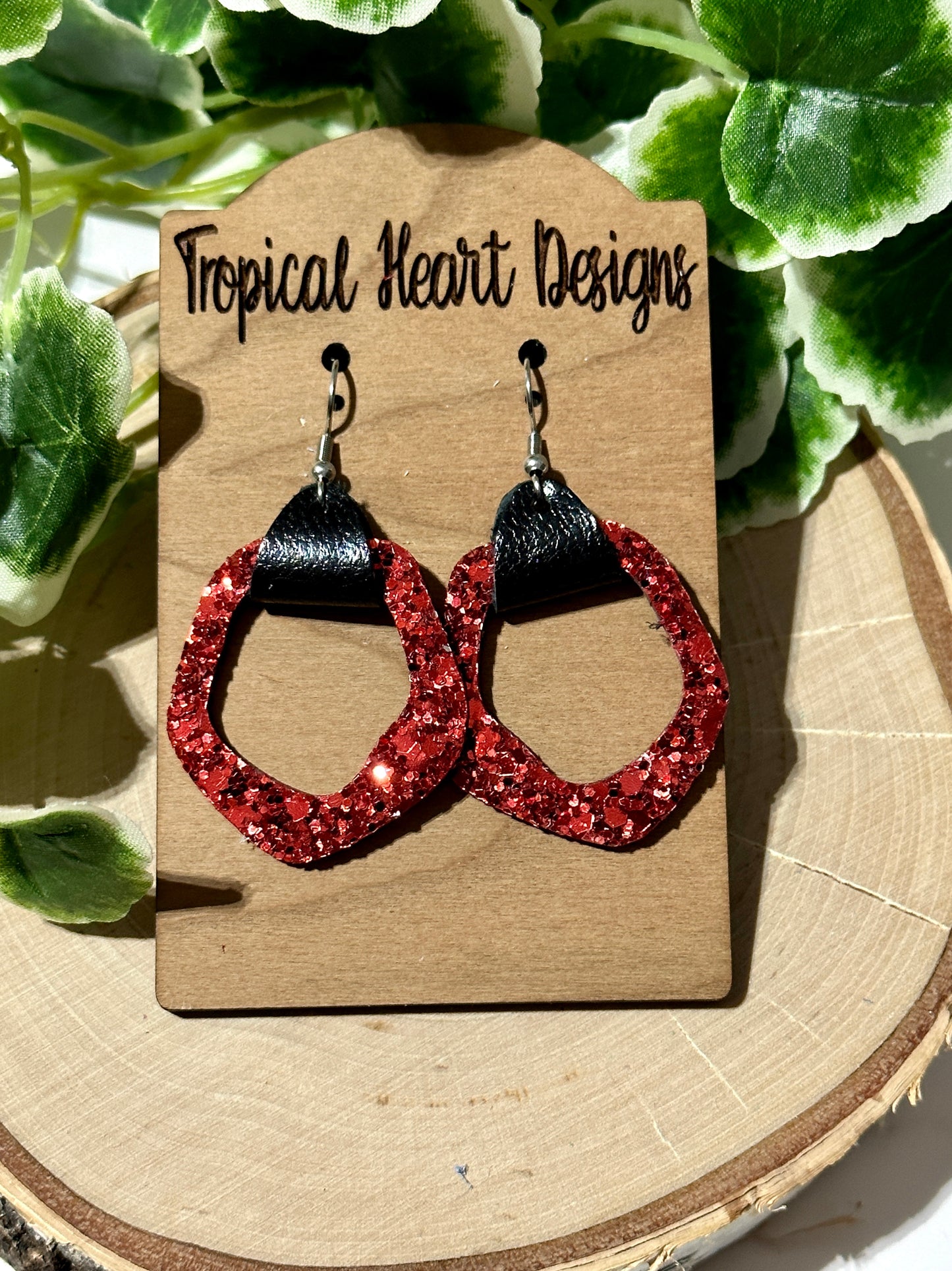 Open geometric red glitter earrings