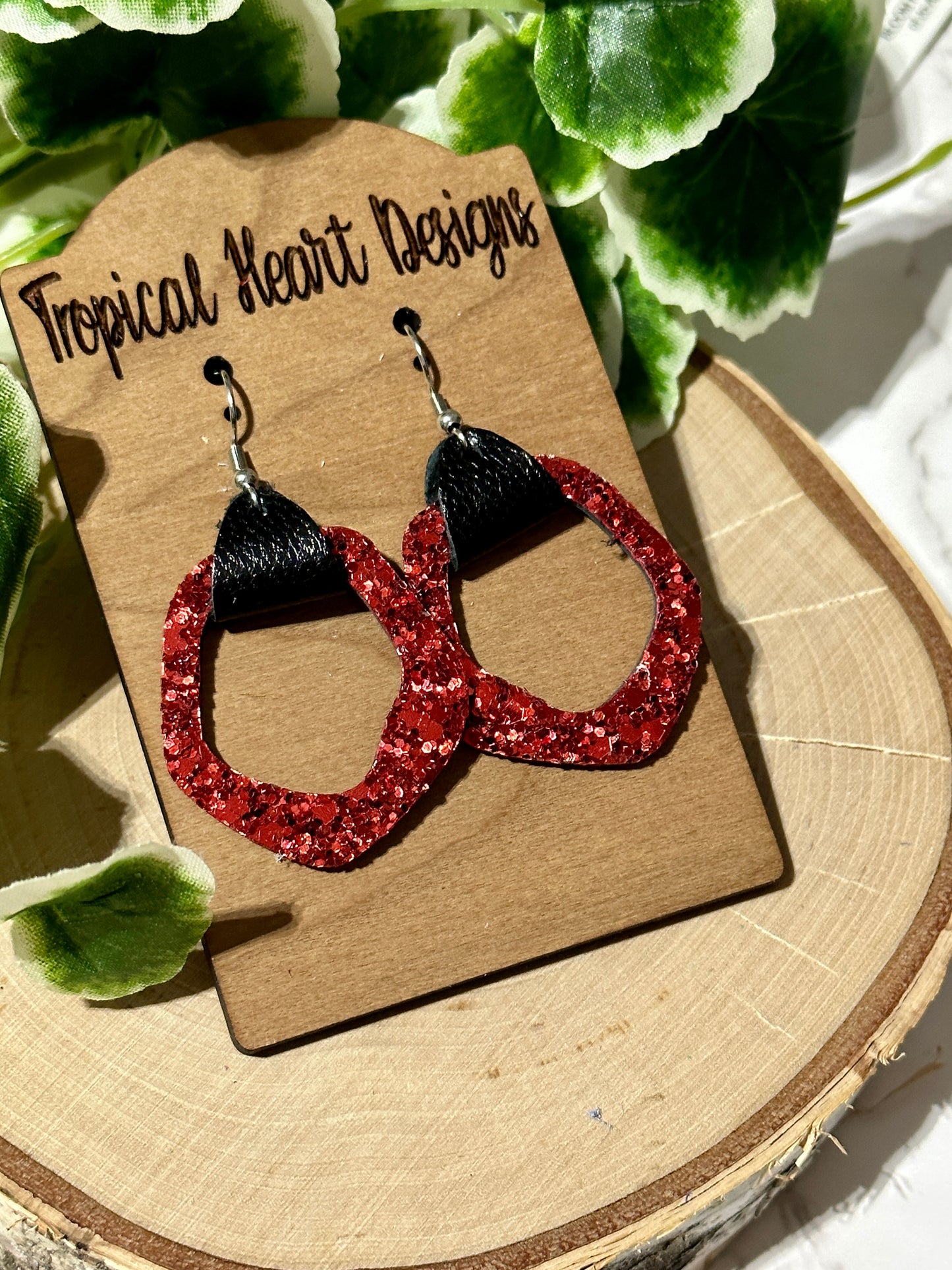 Open geometric red glitter earrings