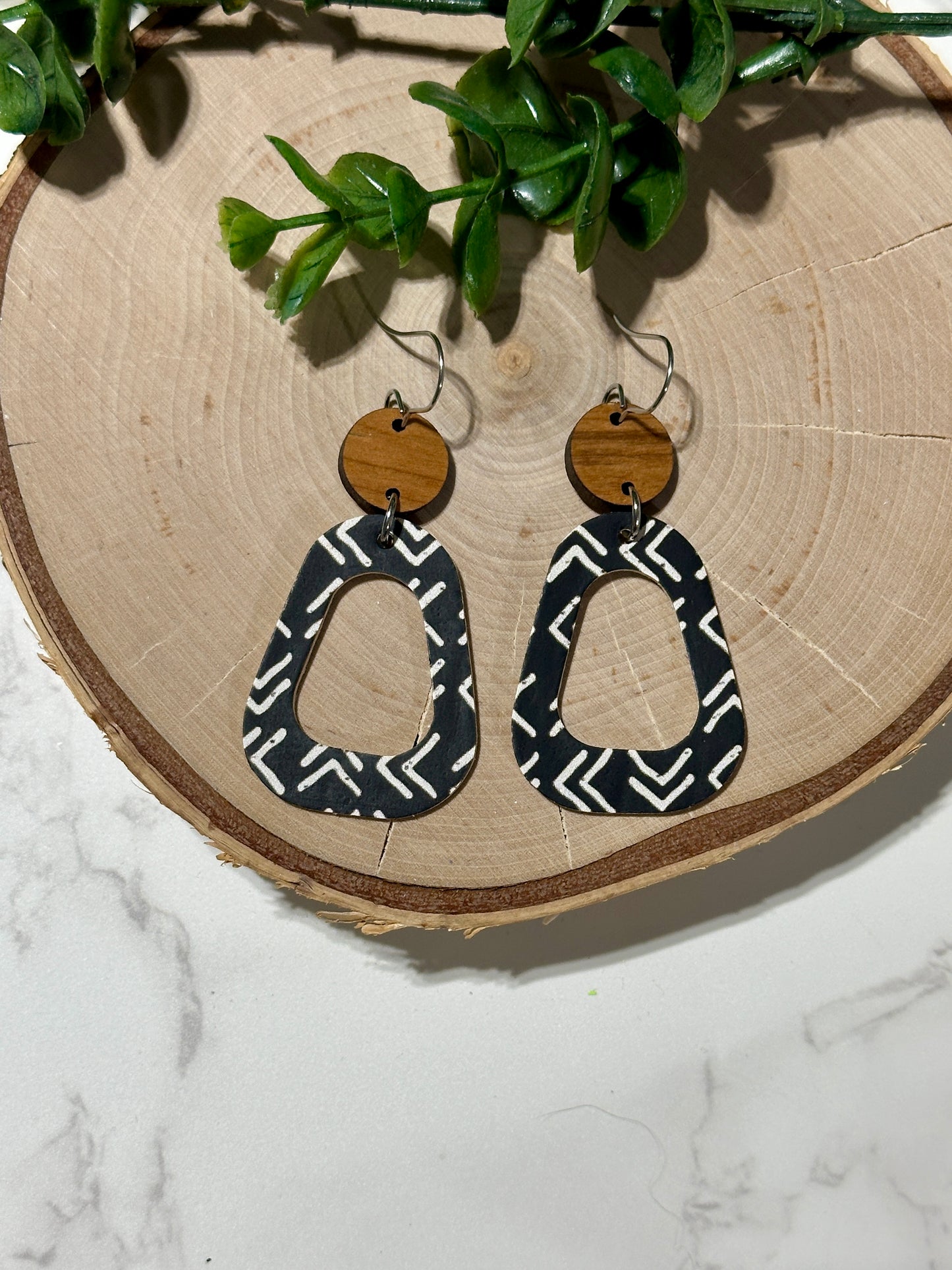Open Rounded Triangle Earrings - White Arrows on Black