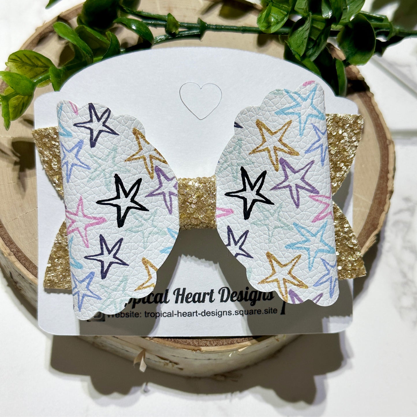 Stars on gold glitter hairbow