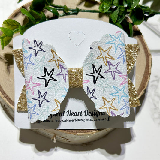 Stars on gold glitter hairbow
